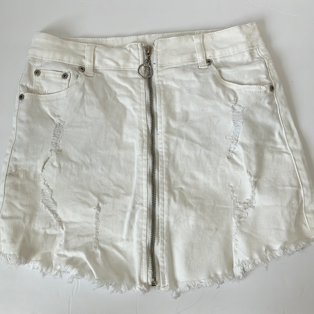Distressed white denim zip-up skirt